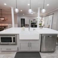 Kitchen island with luxury farmhouse sink and built in microwave
